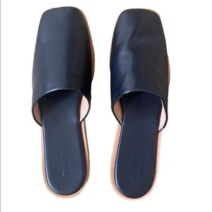 Fun slip ons. Black leather with a tan trim. Not for wide feet!